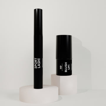 A set of Motion Beauty Sport Lash Waterproof Mascara and the Blush Up Lip and Cheek Stick on a semi-white background.